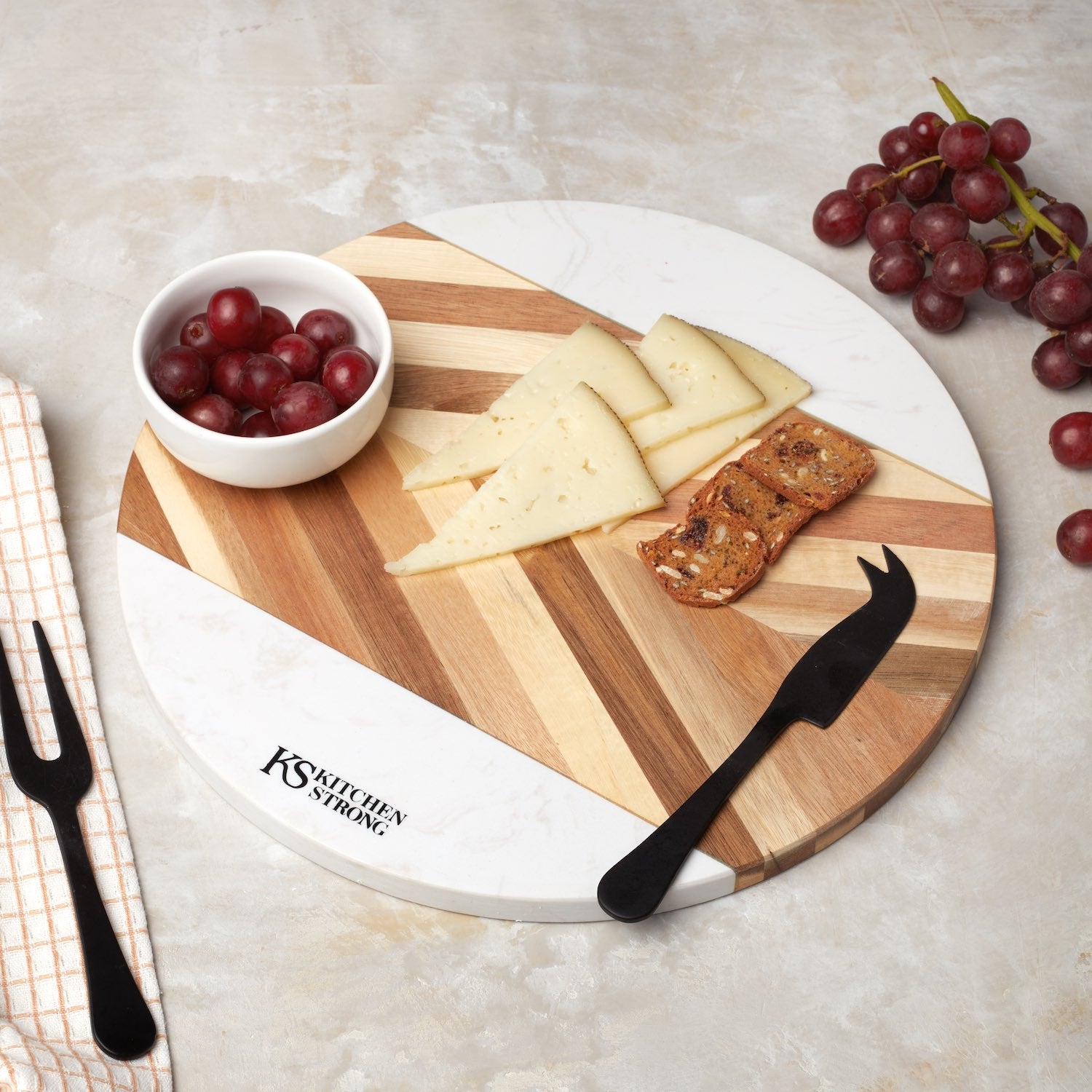 Round premium acacia wood and marble serving board. Charcuterie board with cheese and fruit